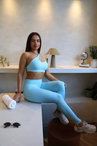 Crossed shoulder sports bra