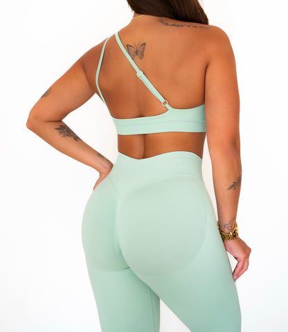 Crossed shoulder sports bra